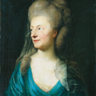 Regal woman portrait in blue dress with jeweled headdress