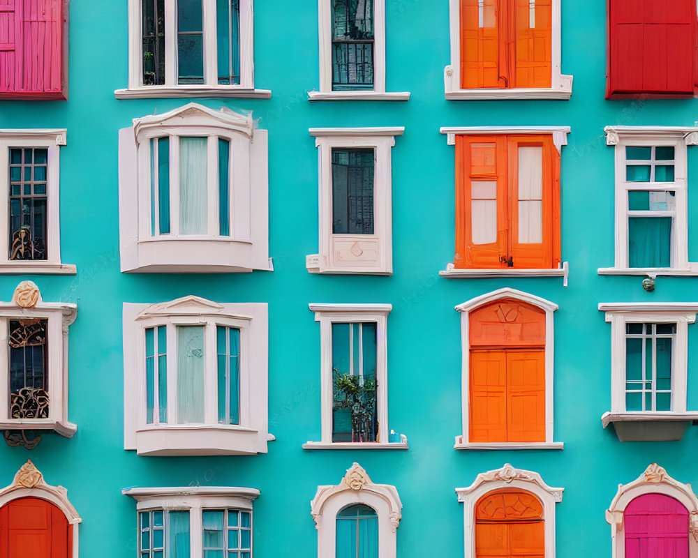 Colorful Windows on Turquoise Facade with Red, White, and Orange Shutters