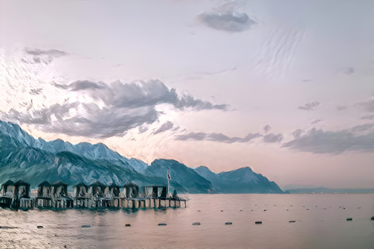 Stilt Houses in a Mountain Lake at Sunset