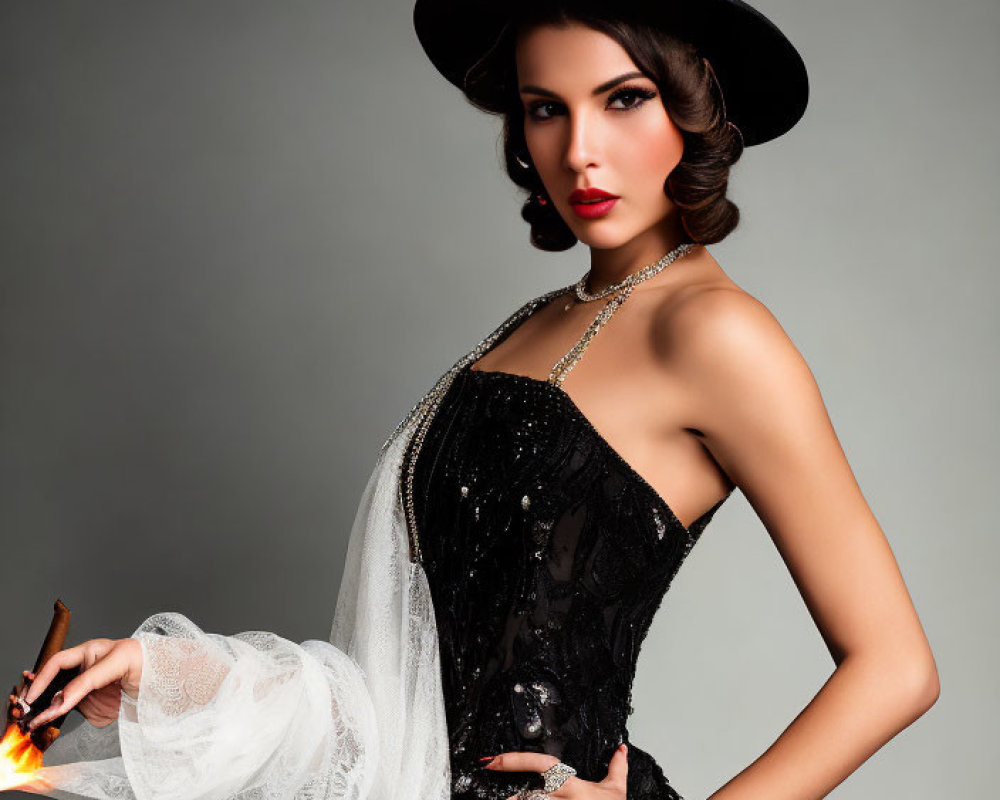 Elegant woman in black dress and hat with vintage makeup and accessories