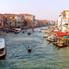 Historic buildings and gondolas in Venice canal