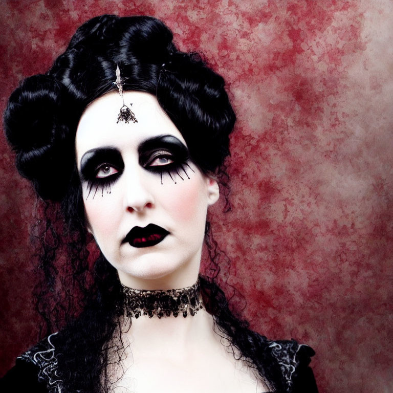Pale-skinned woman with gothic makeup and Victorian hairstyle on red background