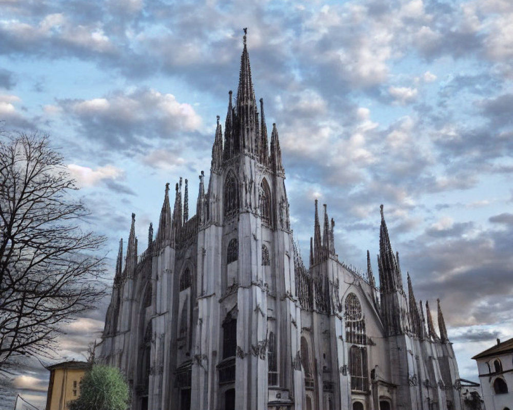 Gothic Cathedral with Spires and Cloudy Sky in Empty Square