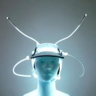 Futuristic halo headgear with neon lights and antennas on person