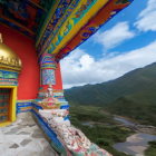Colorful Tibetan Monastery Architecture with Golden Dome by River