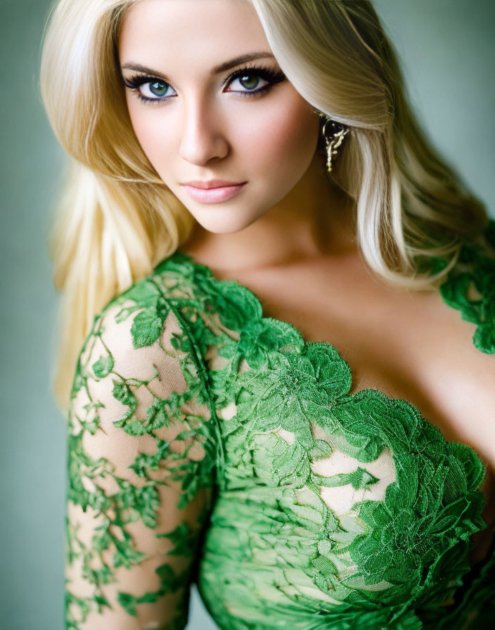 Blonde Woman in Green Lace Dress with Blue Eyes