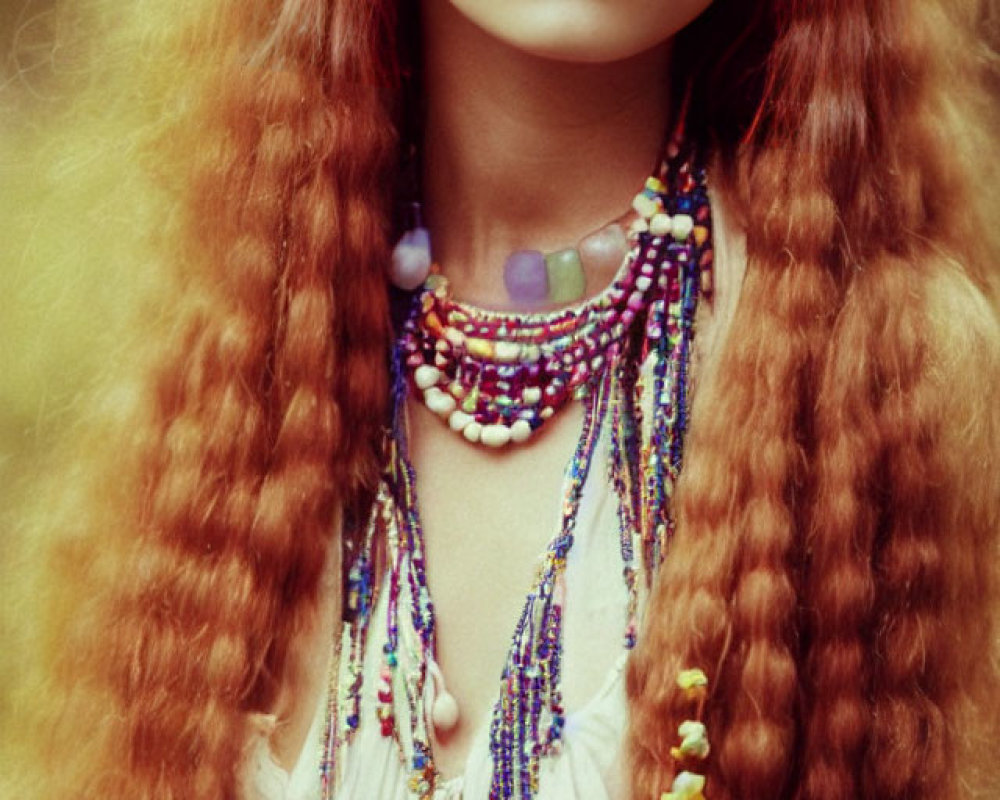 Woman with Long Auburn Hair and Beaded Necklaces in Cream Blouse