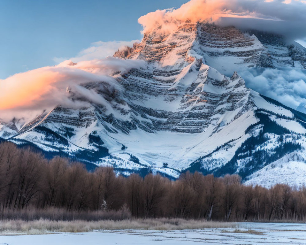 Snowy Mountain Sunset with Swirling Clouds and Winter Landscape
