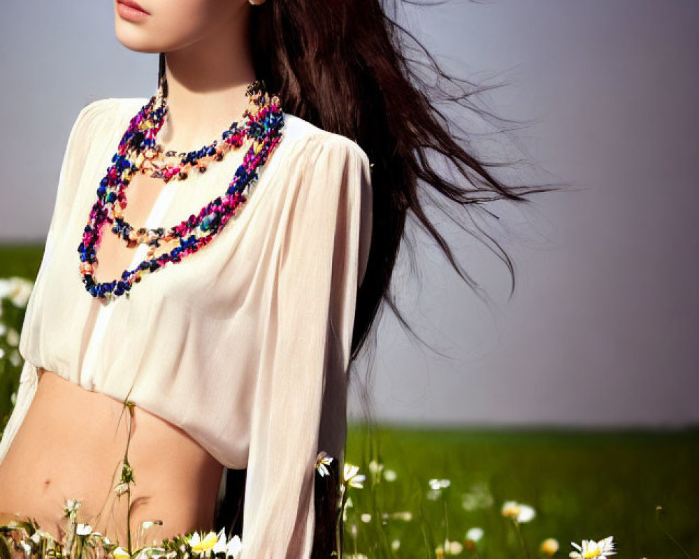 Woman in White Blouse Standing in Daisy Field with Beaded Necklace