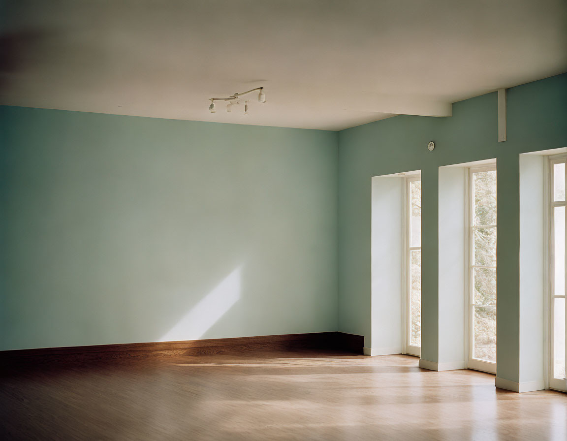 Minimalist Empty Room with Light Blue Walls and White Pillars
