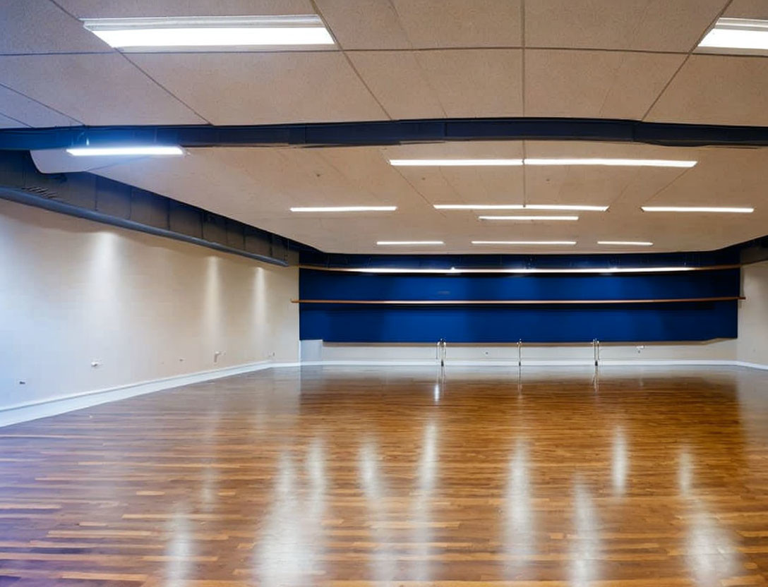 Empty Room with Polished Wooden Flooring and Blue Accent Strip