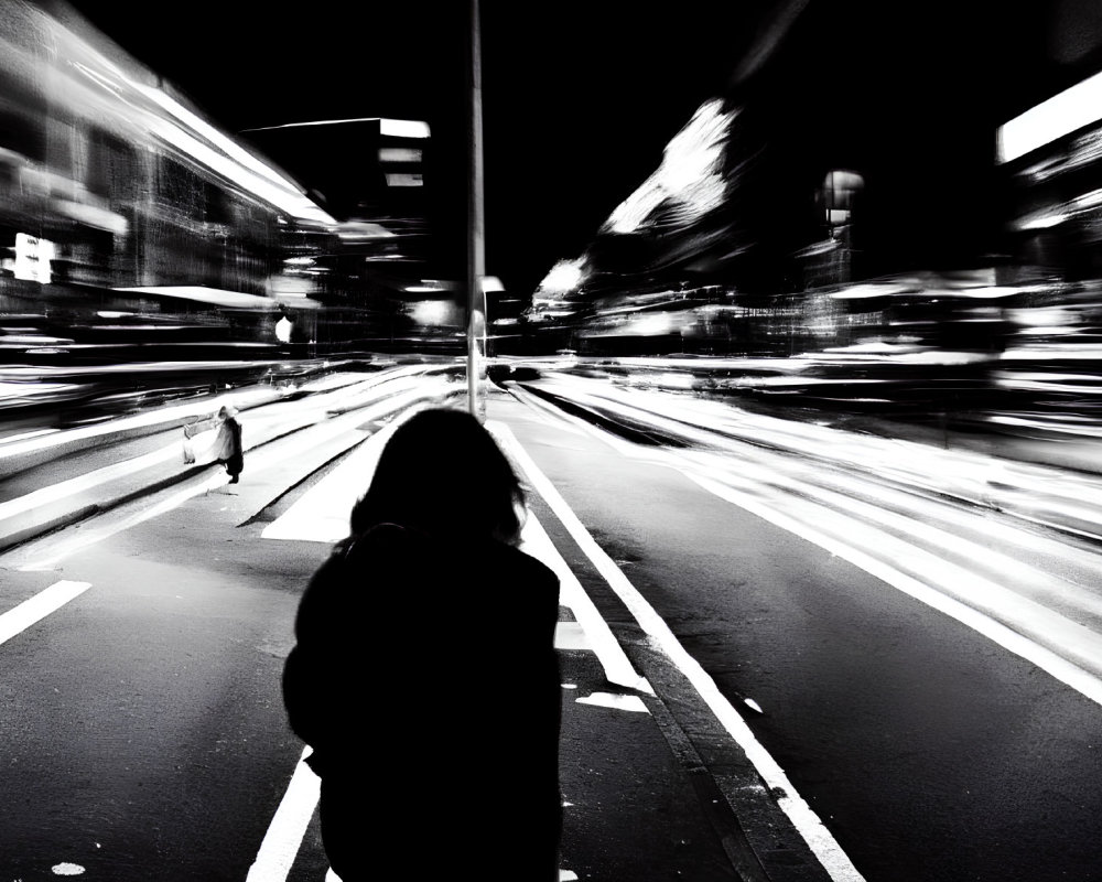 Solitary figure in urban night scene, high-contrast black and white.