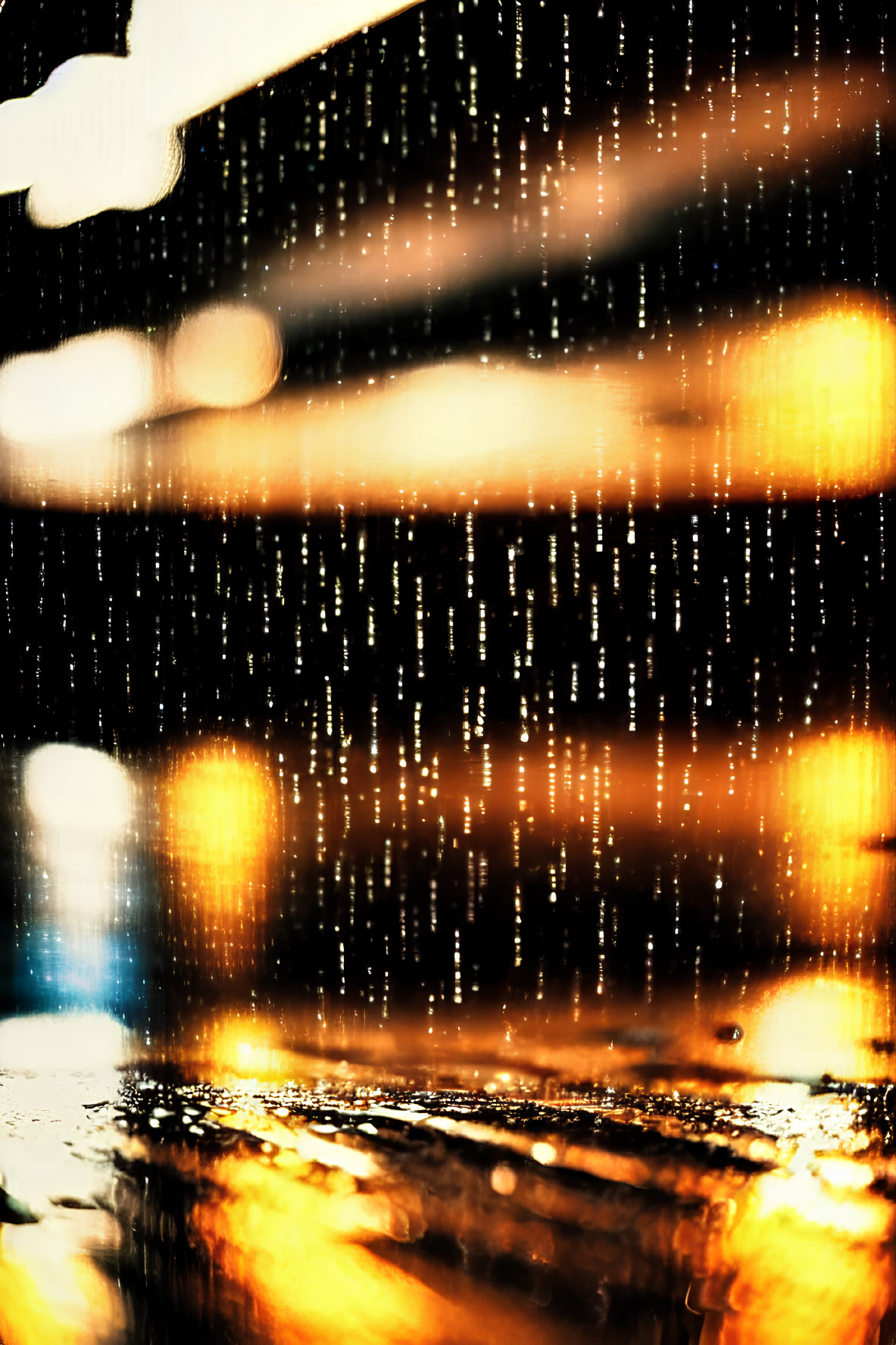 Raindrops streak down window with warm golden lights, creating cozy bokeh.