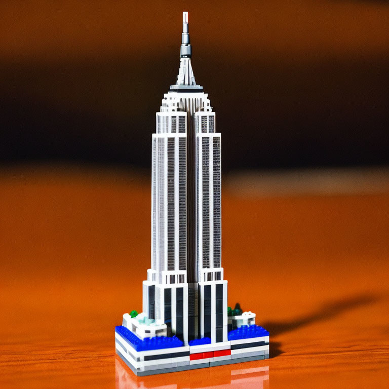 Detailed LEGO Empire State Building model on wooden surface