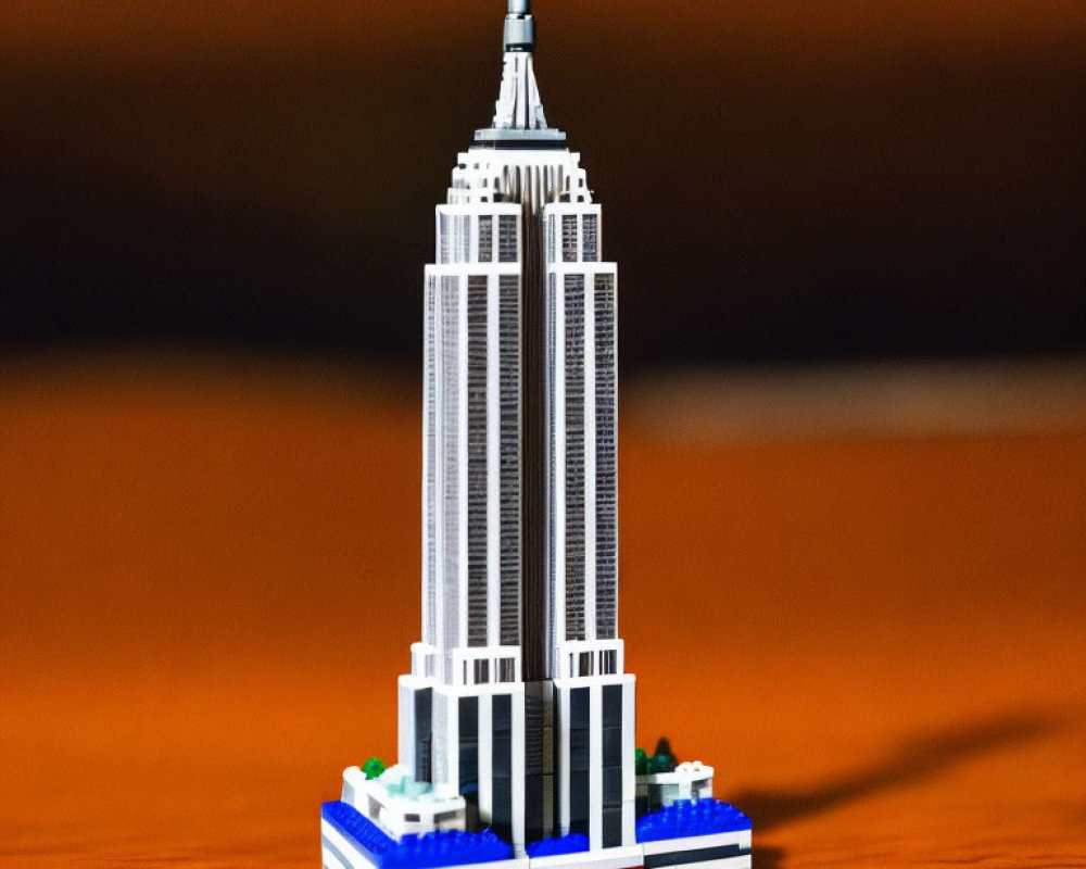 Detailed LEGO Empire State Building model on wooden surface