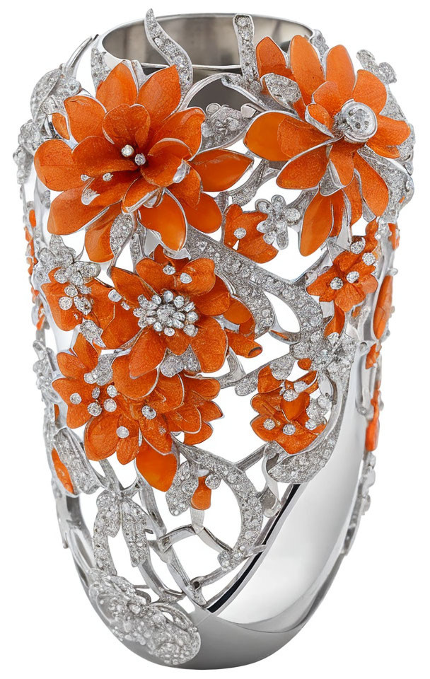 Silver ring with filigree design, orange flowers, and diamond accents
