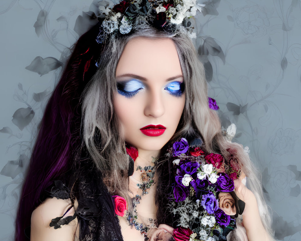 Woman with Blue Eye Makeup and Red Lipstick Holding Dark Roses in Floral Headpiece