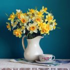 Vibrant Yellow Flowers in White Vase with Floral Patterns and Multicolored Ornaments on Decor