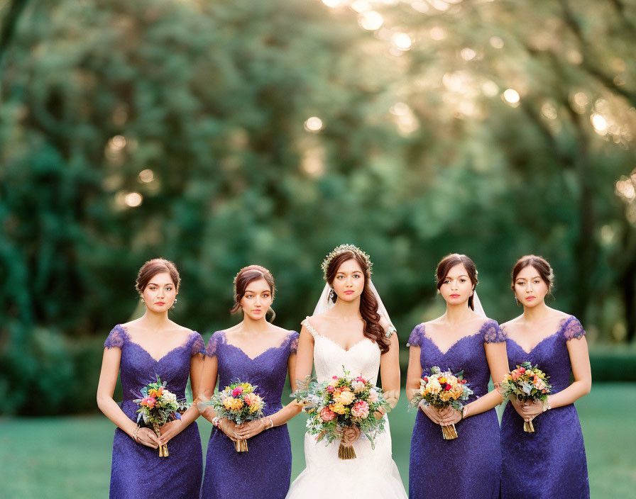 Bride with Four Bridesmaids in Blue Dresses at Lush Park