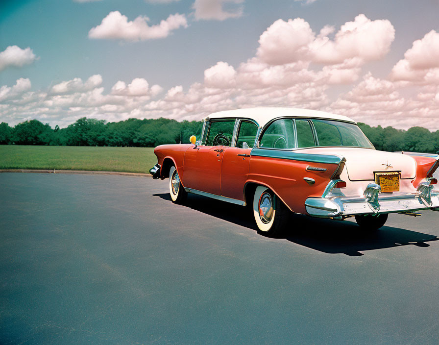 Vintage Red and White Chevrolet Bel Air on Asphalt Road