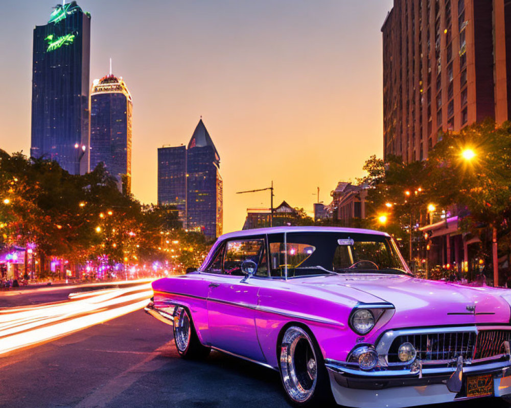 Vintage car parked on city street at twilight with skyscrapers and traffic light trails.