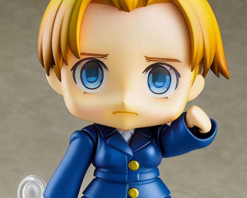 Blonde Hair Chibi Figure in Blue Suit with Pointing Gesture