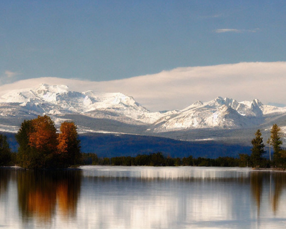 Scenic autumn lake with snow-capped mountains