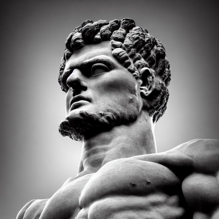 Monochrome image of muscular male sculpture with curly hair