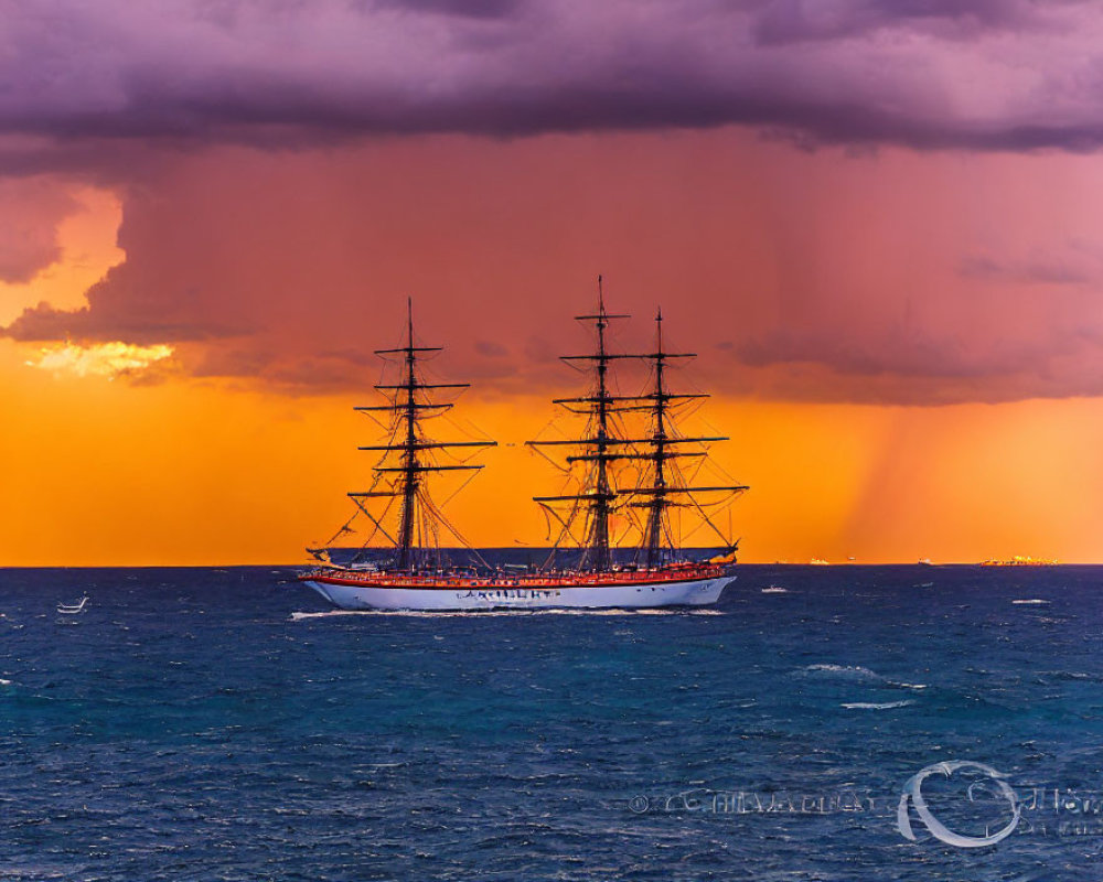 Tall ship with multiple masts sailing at sunset