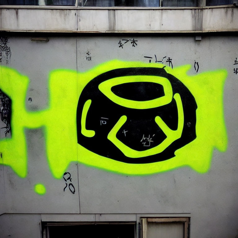 Colorful graffiti eye symbol on urban wall with inscriptions.