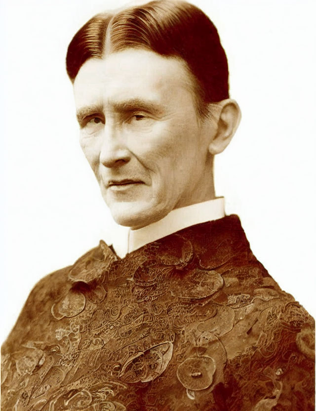 Vintage portrait of a person with center-parted hair in high-collared attire