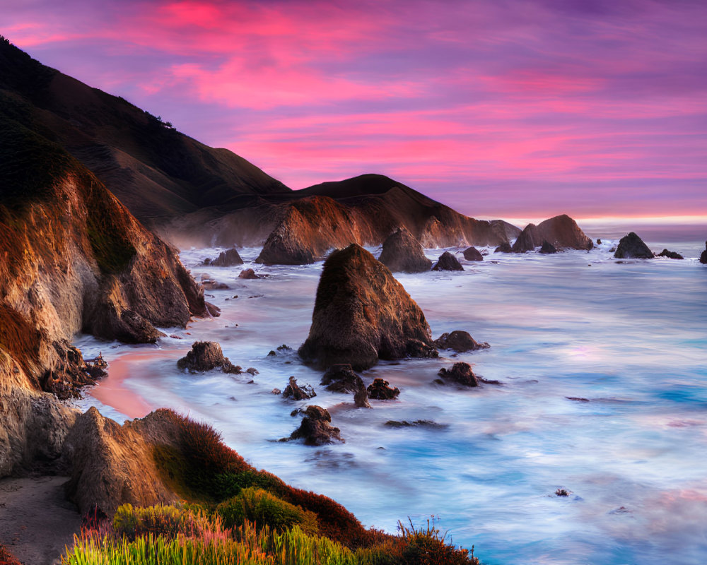 Scenic coastline at sunset with pink hues and steep cliffs