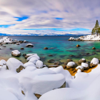 Tranquil Winter Lake Scene with Snow-Covered Shores