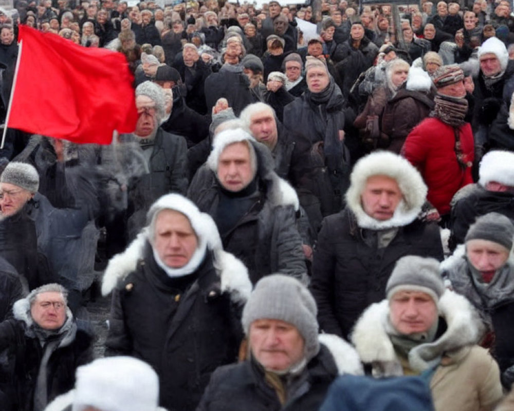 Crowd in Winter Clothing with Red Flag Outdoors