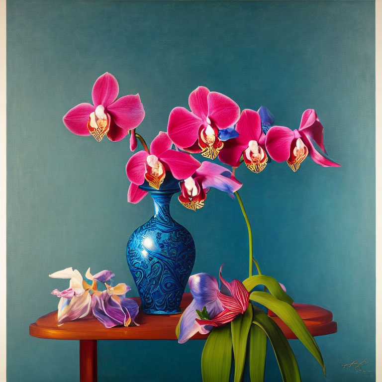 Pink orchids in blue vase on wooden table against teal background