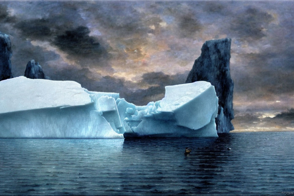 Iceberg floating on calm waters under dramatic sunset sky with cliffs and bird.