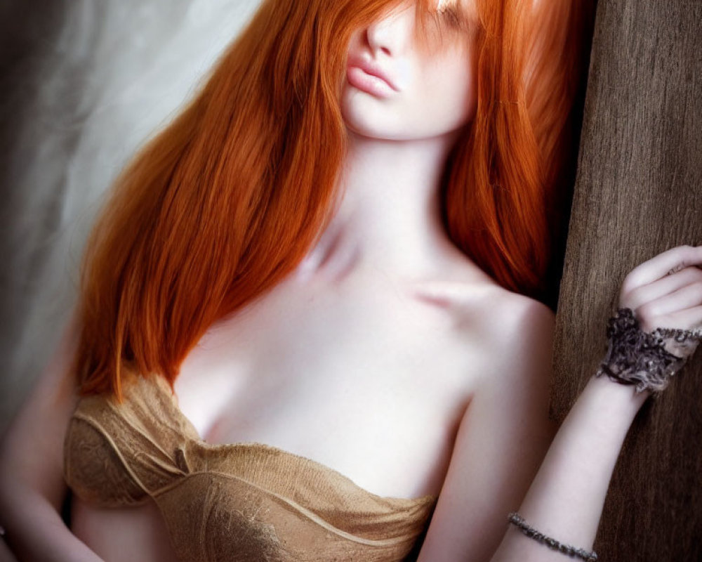 Red-haired woman in strapless top leaning on wooden surface