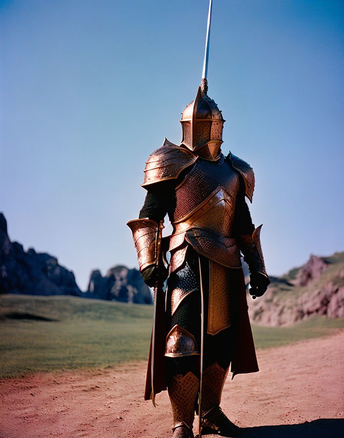 Medieval knight in armor with lance on green hills and blue sky