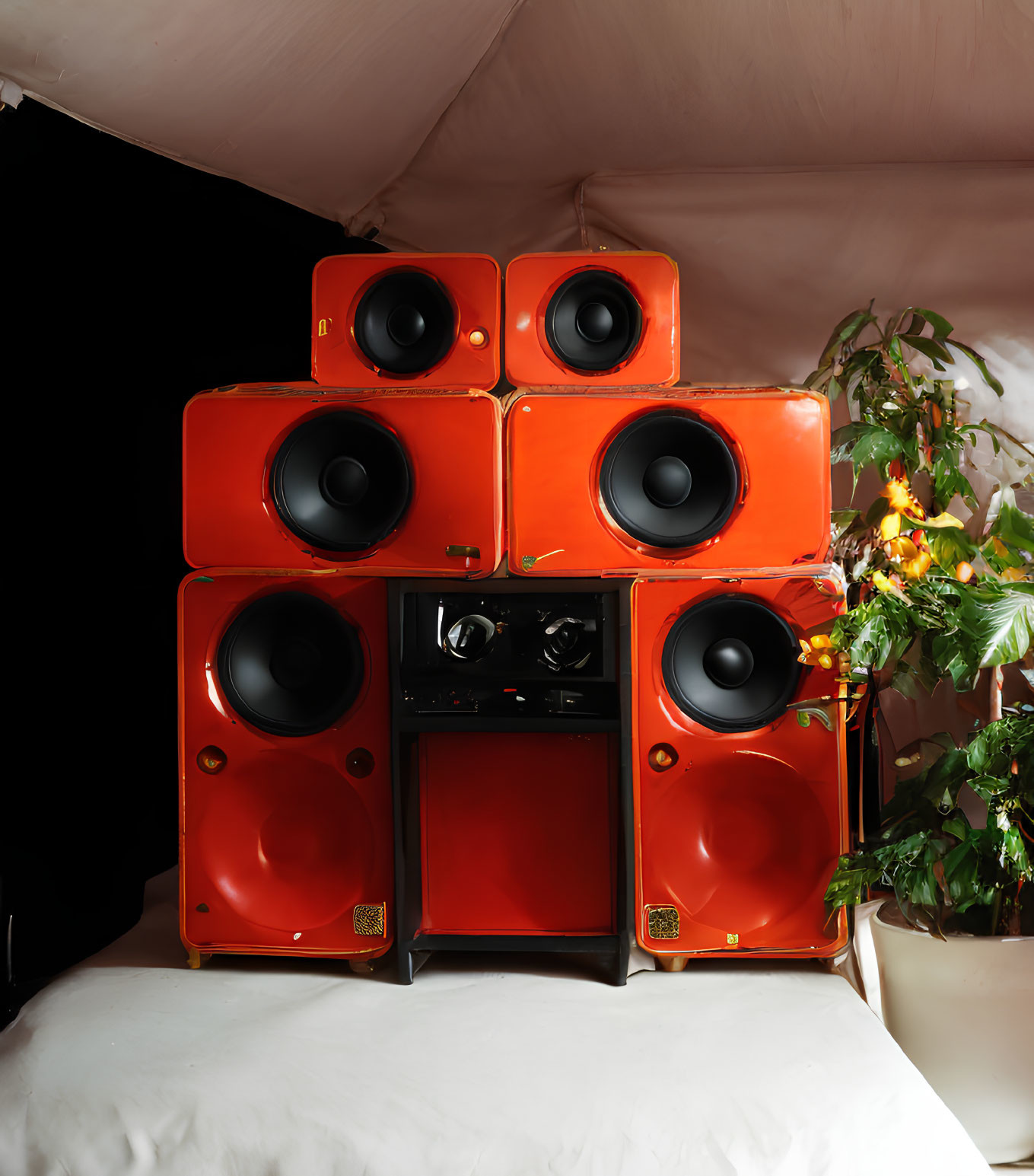 Vibrant orange speakers with black accents in cozy retro setting