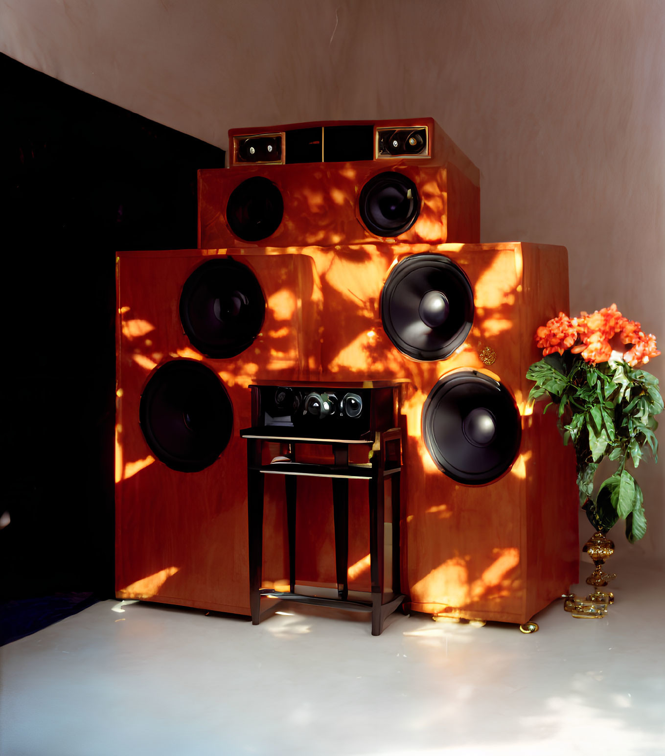 Vintage speaker system with wooden finish and amplifier in warmly lit room