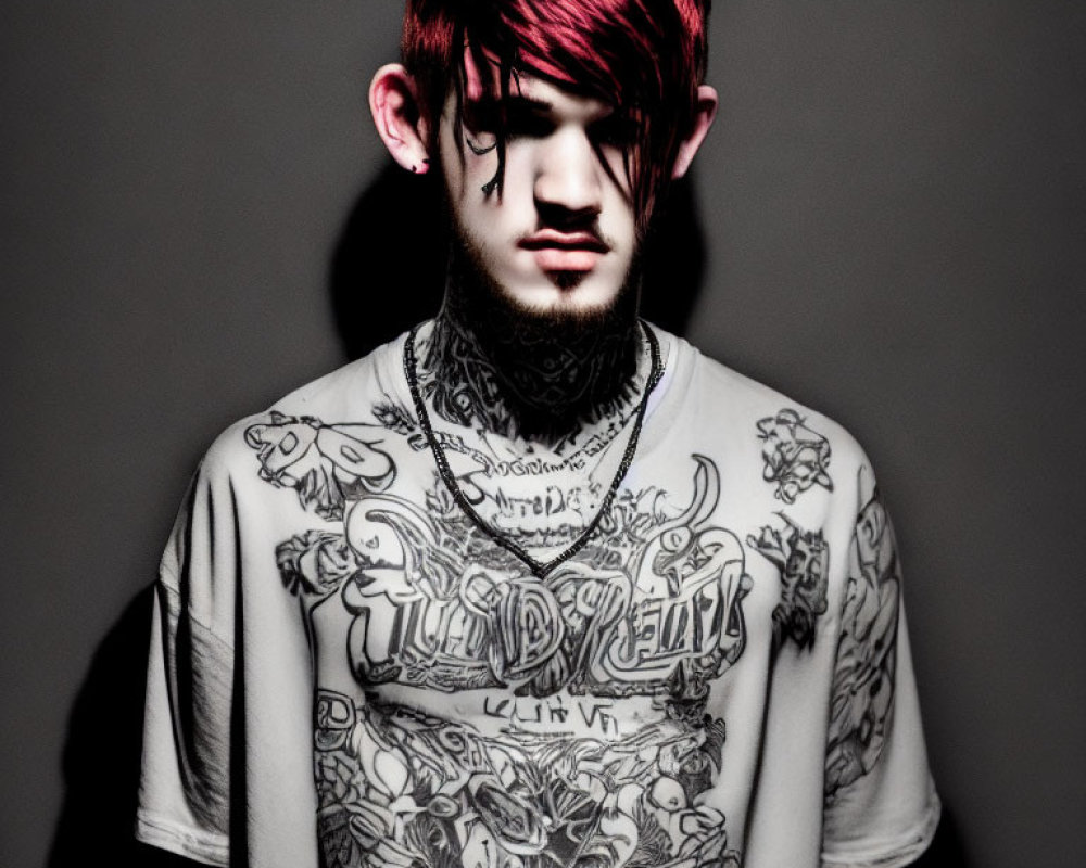 Pink-haired person with tattoos casting shadow on gray background