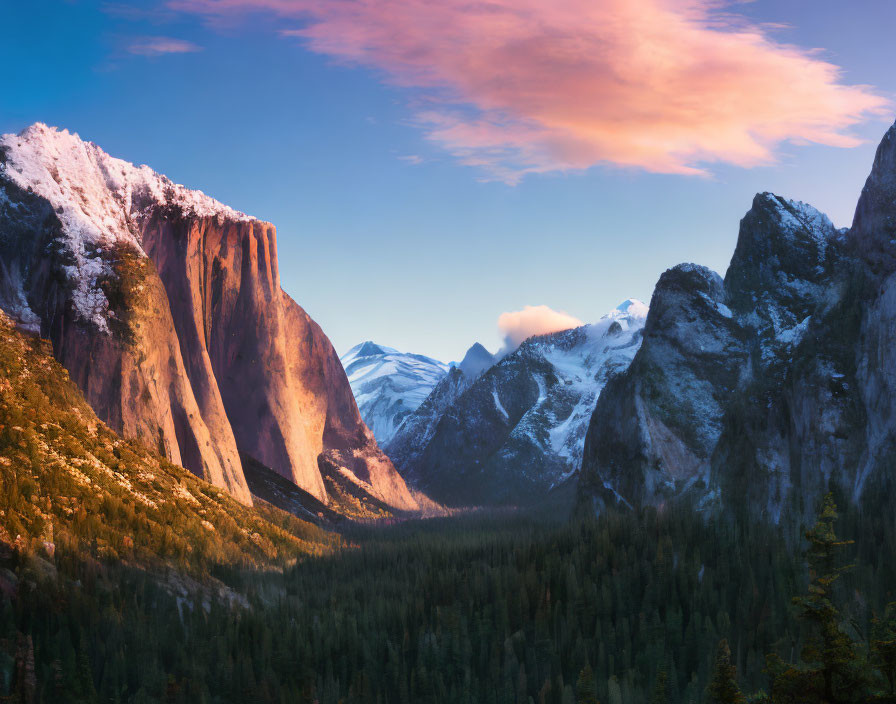 Snowy mountain valley at sunset with towering cliffs and forested area under vibrant sky