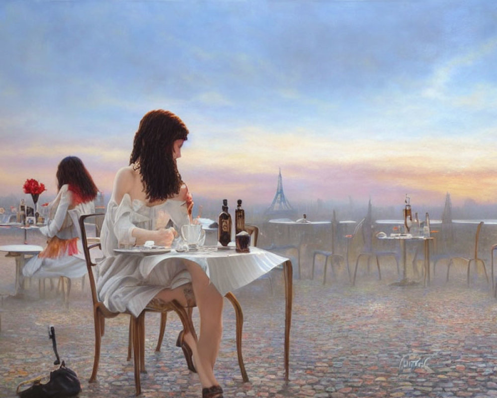 Two women at outdoor café near Eiffel Tower at sunset