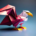 Vibrant origami eagle with red, white, and yellow details on blue background