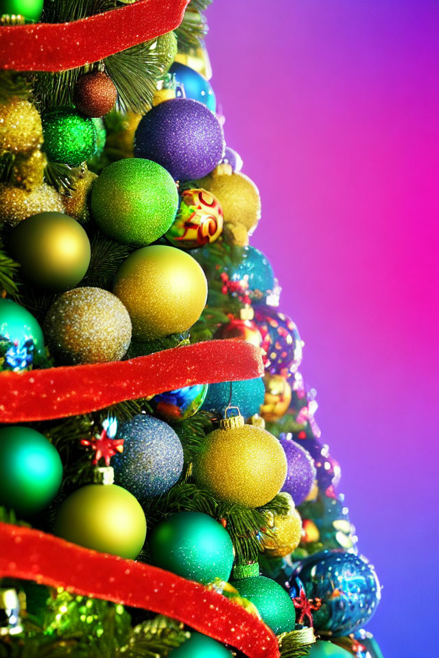 Colorful ornaments on vibrant Christmas tree against purple and blue backdrop