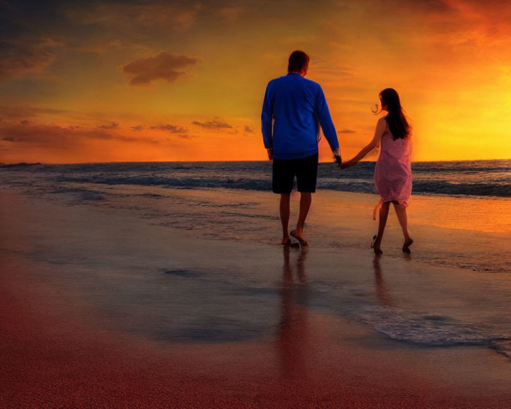 Sunset beach scene with two people holding hands