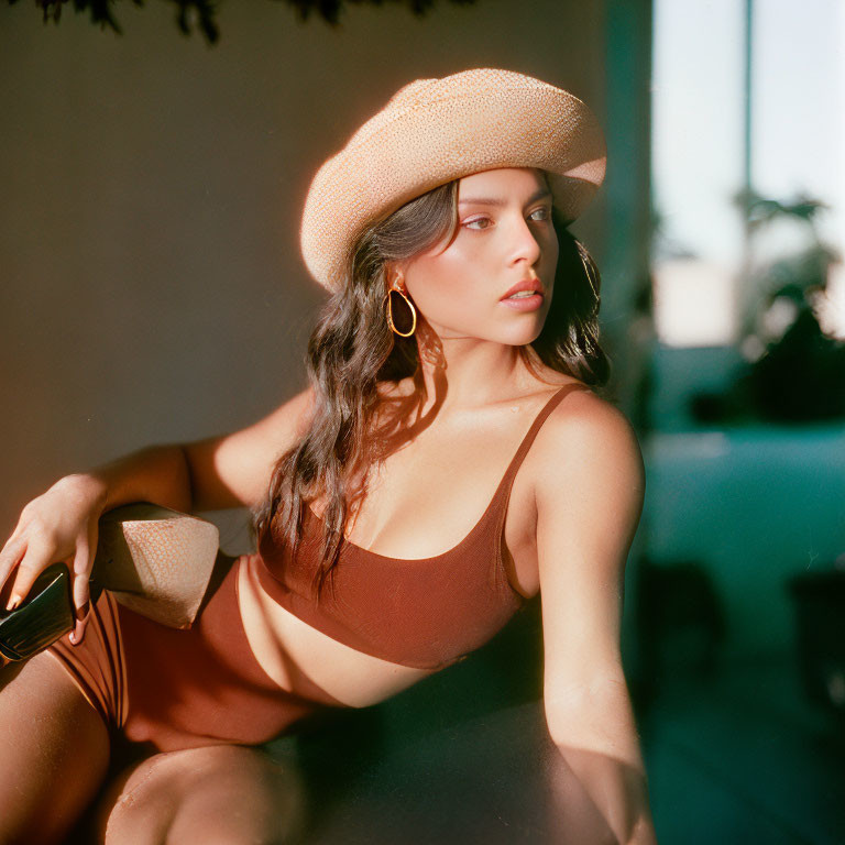 Woman in Brown Outfit and Hat Poses in Warm Retro Ambiance