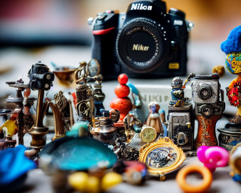 Nikon camera with eclectic trinkets and vintage items