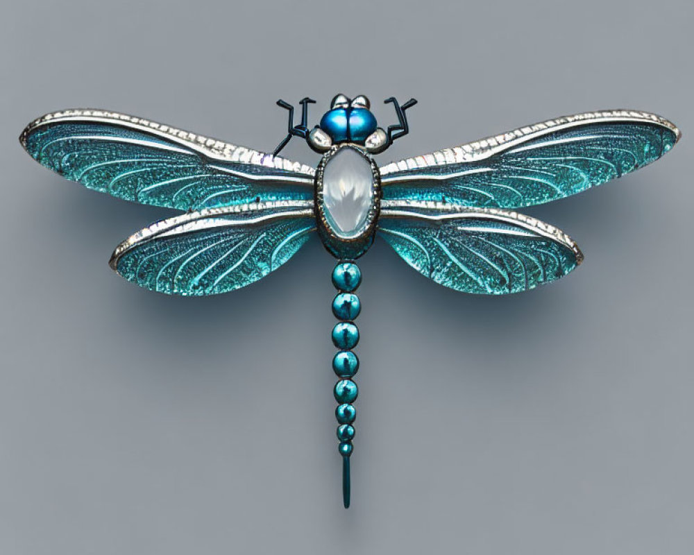 Blue and Silver Dragonfly Brooch with Gemstone Body on Grey Background