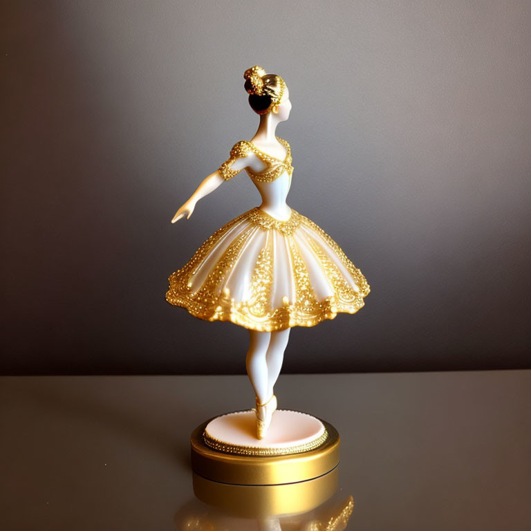 Porcelain ballerina figurine with gold detailing in ballet pose